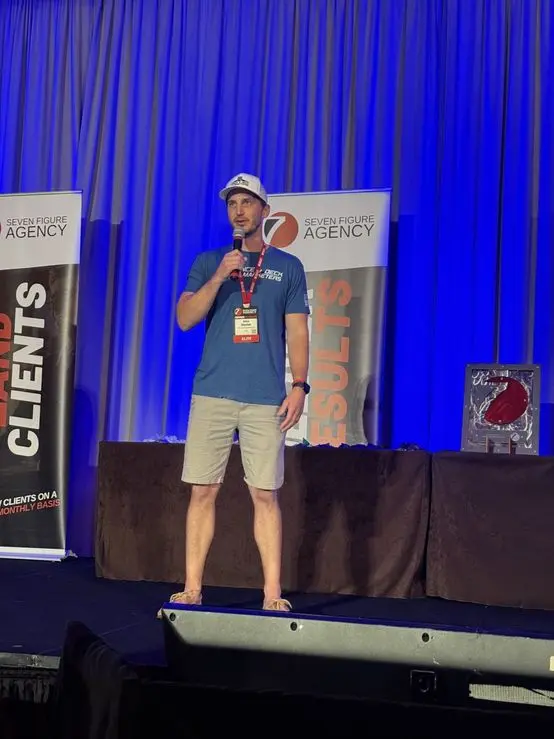 Sharing his story on stage at a Seven Figure Agency event