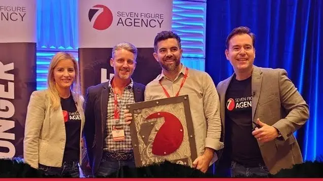 Cohen Wills and Justin Kane receiving their Seven Figure Agency award
