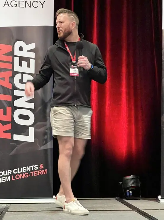 Austin sharing his retention playbook from the Seven Figure Agency stage