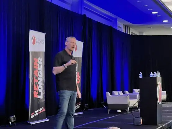On stage at a Seven Figure Agency event