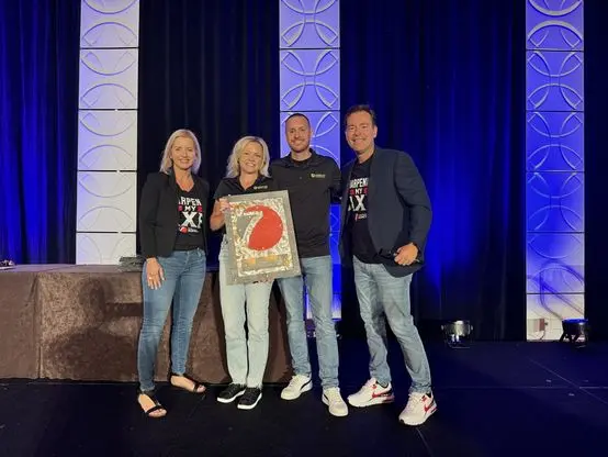 Tony and Angela Ricketts accepting their award with Josh and Yesenia