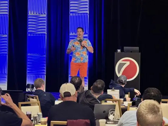 Matt speaking from the Seven Figure Agency stage