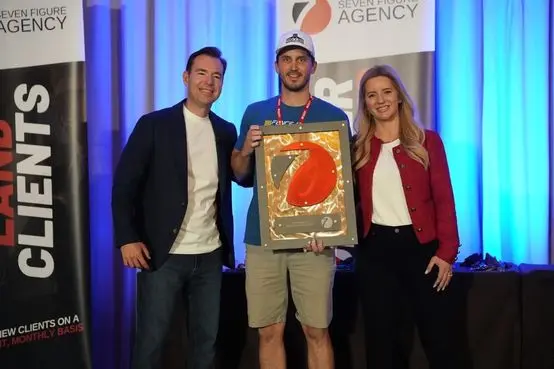 Accepting his Seven Figure Agency award from Josh and Yesenia Nelson