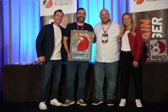 Accepting the multiple seven figure agency award with Josh and Yesenia Nelson