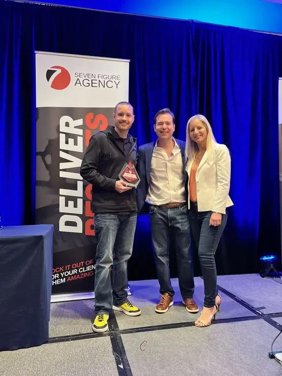 Accepting an award on stage with Josh and Yesenia Nelson