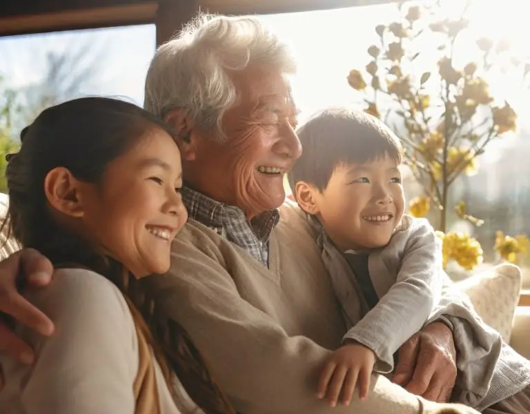 Grandfather embracing his grandchildren, symbolizing long-term financial security and generational wealth with Fixed Indexed Annuities in Plano, Texas.