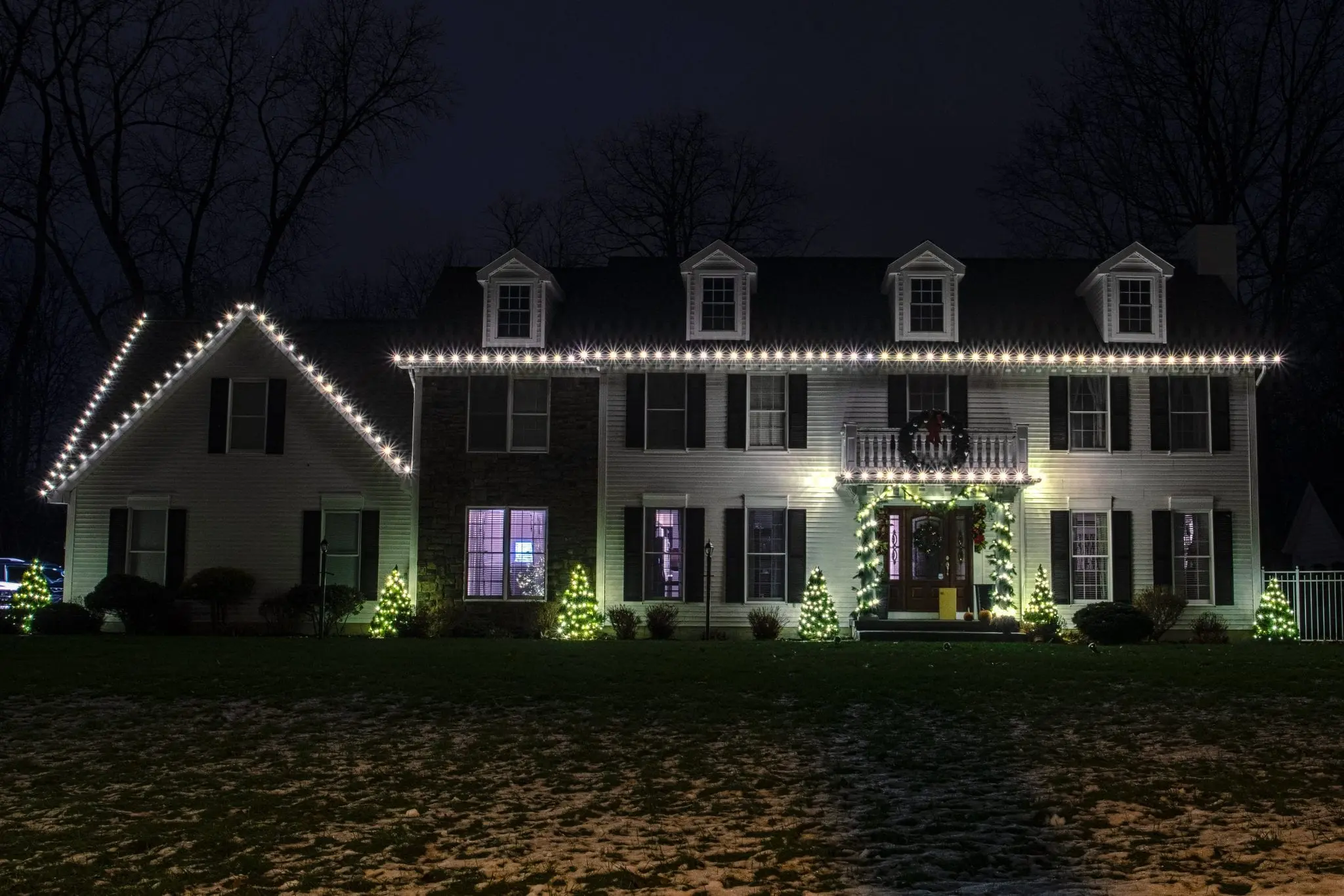 WYnantskill area home decorated for Christmas with white lights from The Christmas Guys by Elfperts Inc