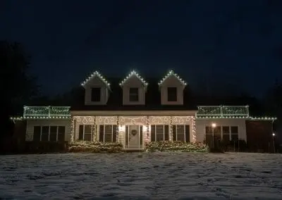 Home in Clifton Park NY decorated for Christmas with a custom made hanging motif crafted by The Christmas Guys