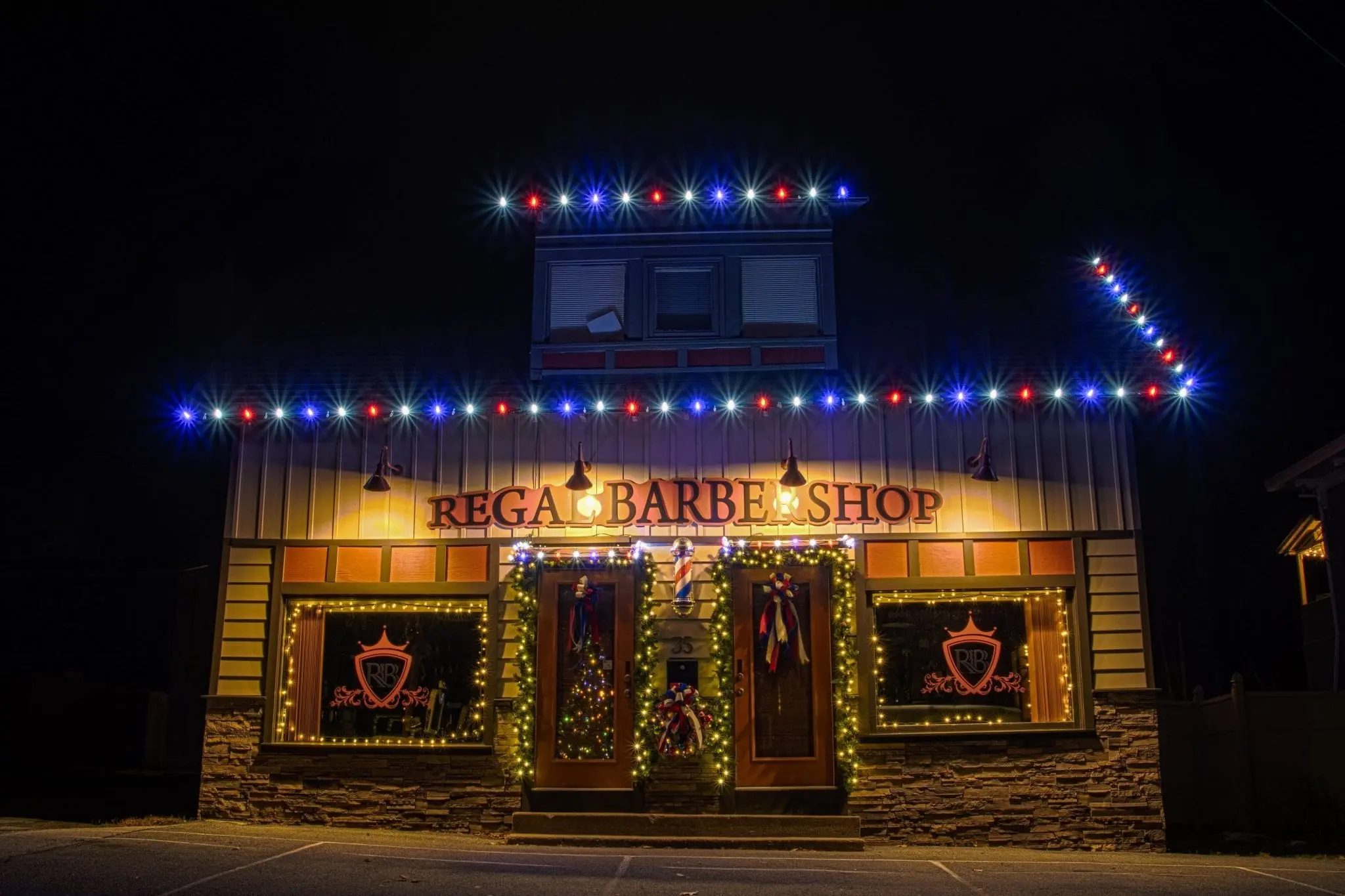 red white and blue led lights on a barber shop decorated for christmas time