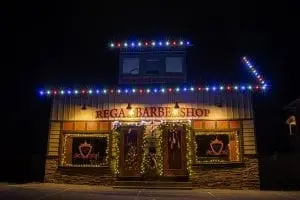 red white and blue led lights on a barber shop decorated for christmas time