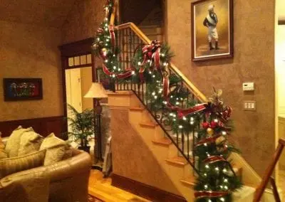 interior garland hanging on stairs in an ALbany NY home