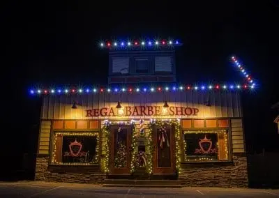 red white and blue led lights on a barber shop decorated for christmas time