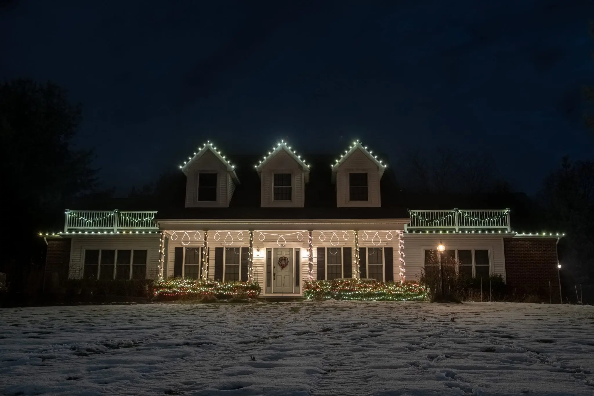 Home in Clifton Park NY decorated for Christmas with a custom made hanging motif crafted by The Christmas Guys