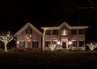 Latham NY home decorated for the holidays with thousands of white led lights