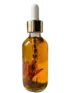 Unlabelled Luster Botanical Face and Body Oil in a clear glass dropper bottle