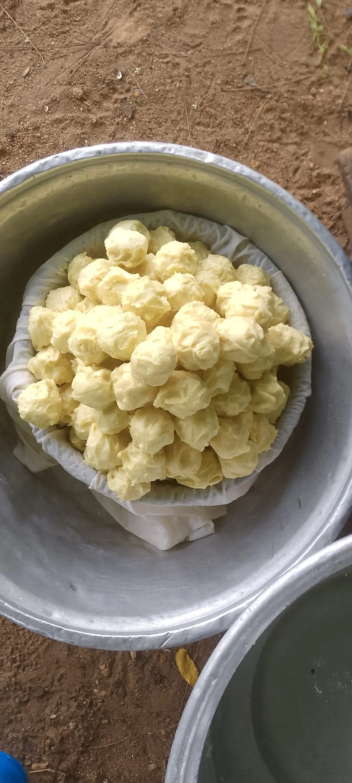 Unbranded shea butter pieces in a bowl