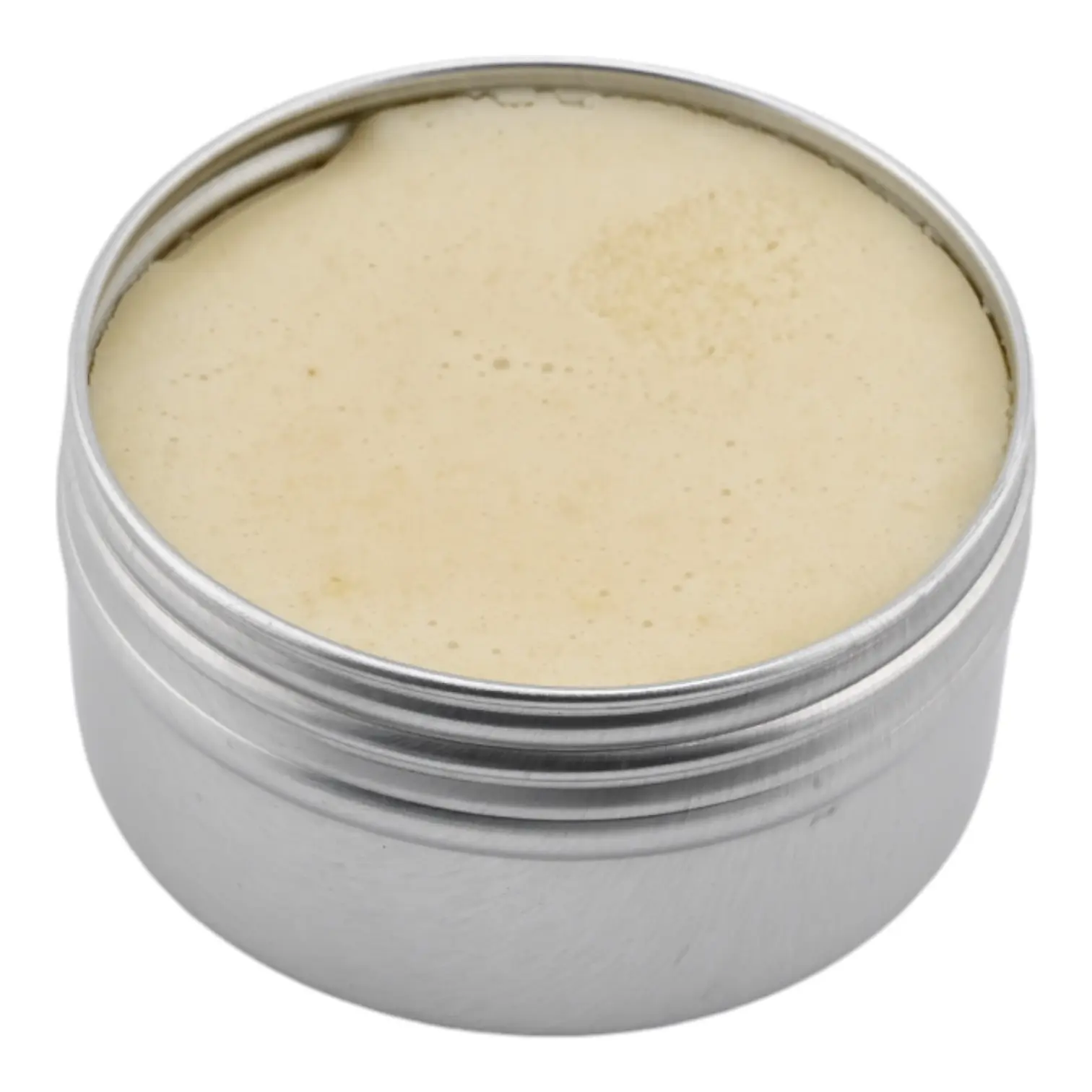 Open one ounce Thrive Botanical Balm tin showing the neutral balm texture