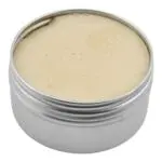 Open one ounce Thrive Botanical Balm tin showing the neutral balm texture