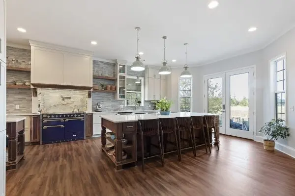 Kitchen remodel with custom cabinets, large island and blue range
