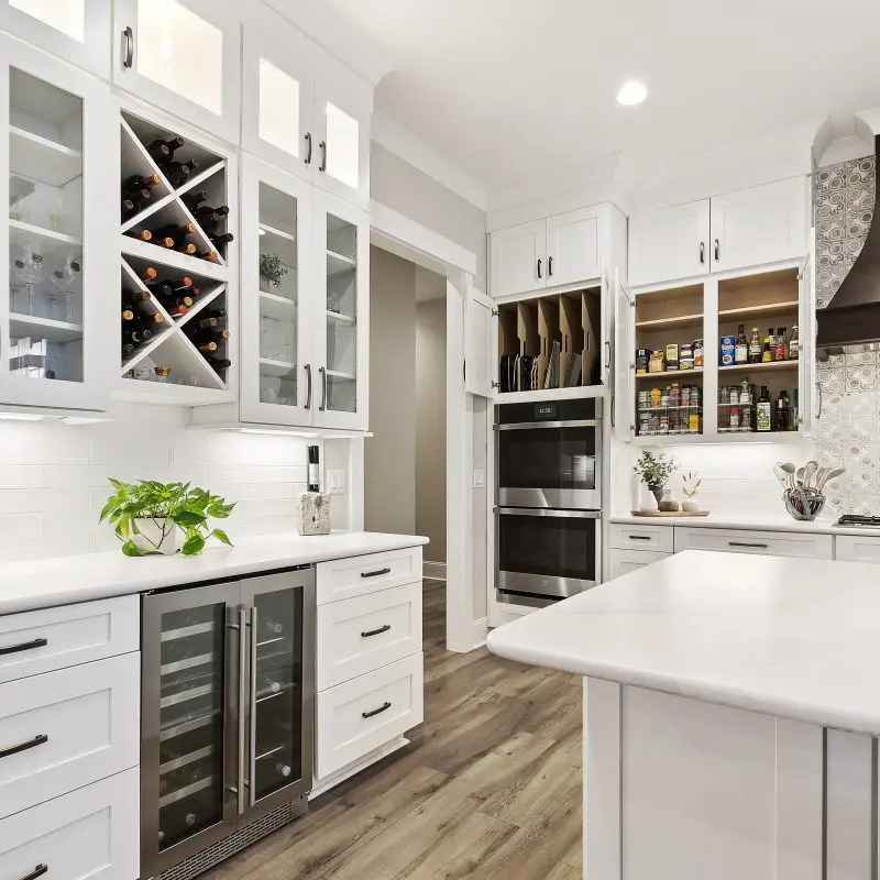 white kitchen with custom glass cabinets in Margaritaville, SC new construction