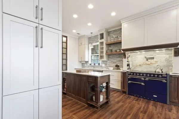 custom kitchen renovation with prep island and blue range