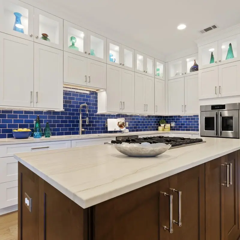 blue and white kitchen remodel with brown island in savannah ga