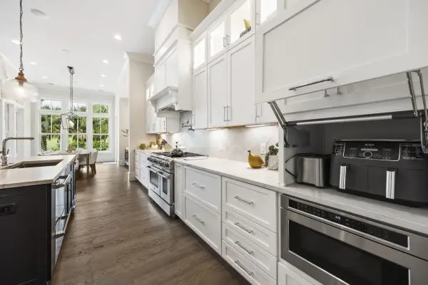 Light and bright kitchen remodel with dark island hilton head
