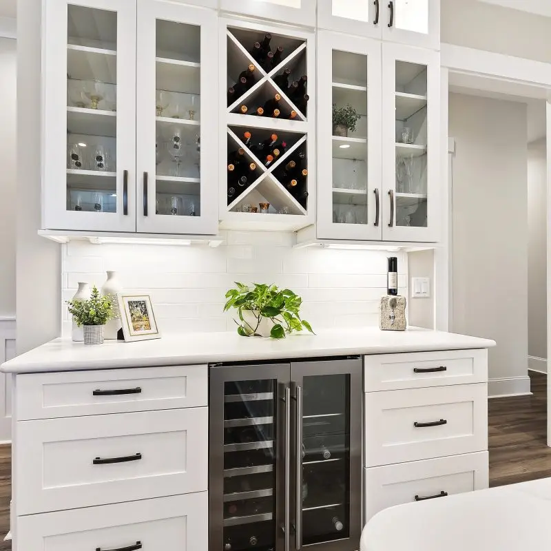 custom white kitchen cabinets and dry bar in Margaritaville, SC new construction
