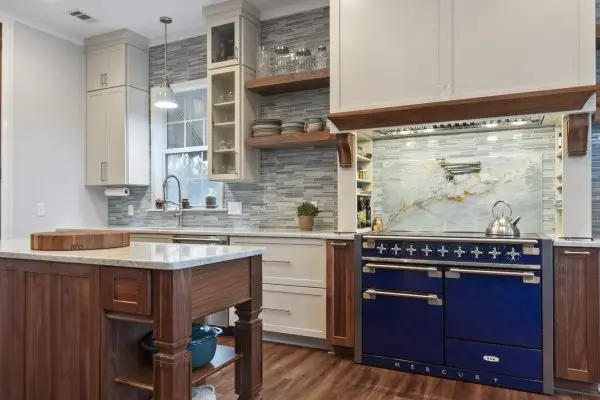 Blue ovens and range with small walnut island