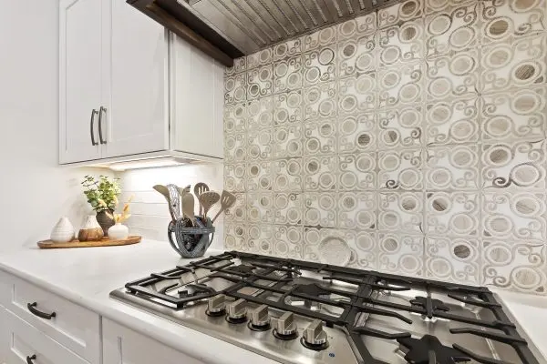 Margaritaville, SC New Construction Kitchen Custom range backsplash with white cabinets in new construction