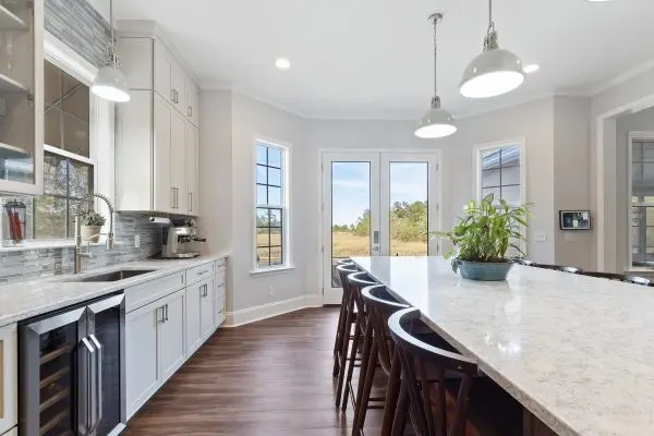 Custom kitchen remodel with natural light, white cabinets and large island