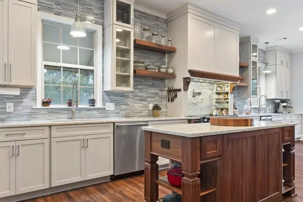 white kitchen remodel with walnut center prep island and custom cabinets