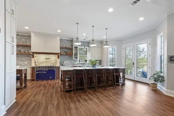 custom kitchen remodel with two islands and blue range