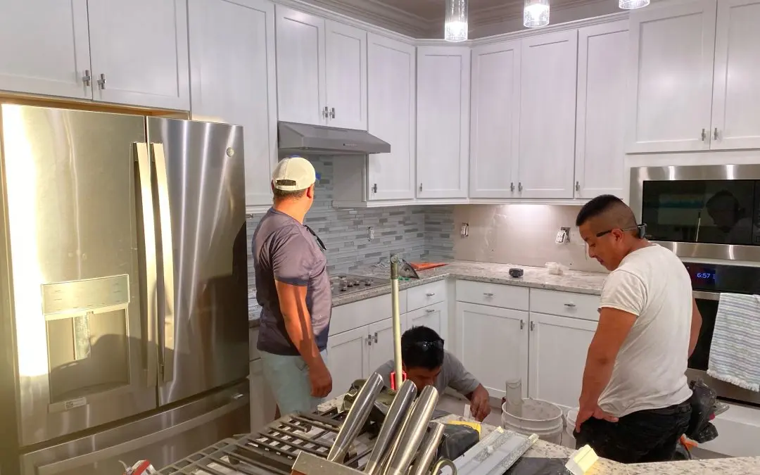 contractors working on a kitchen renovation
