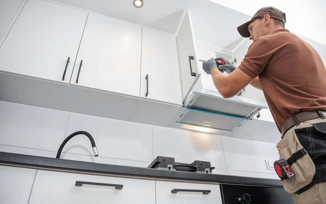 kitchen remodeler installing new cabinets