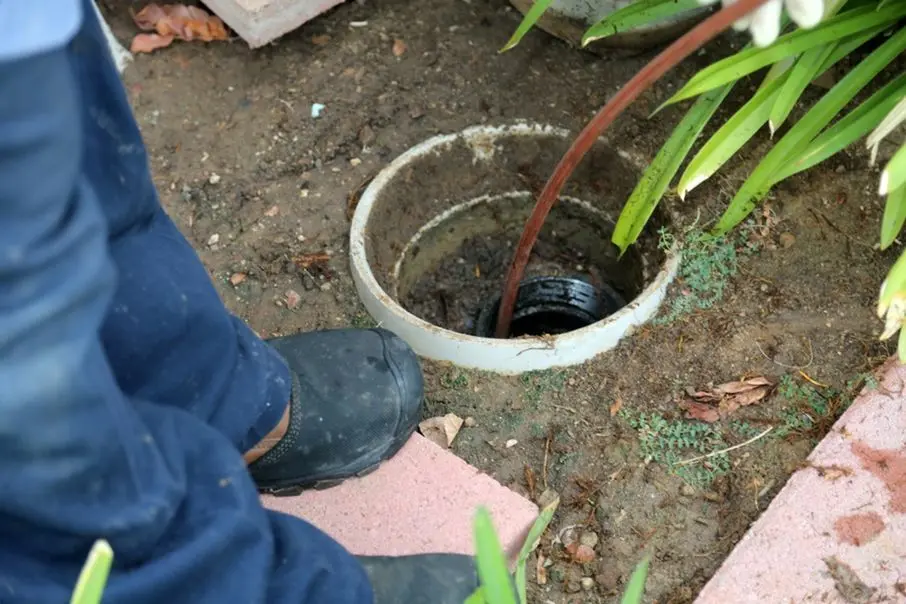 Plumber cleaning a sewer