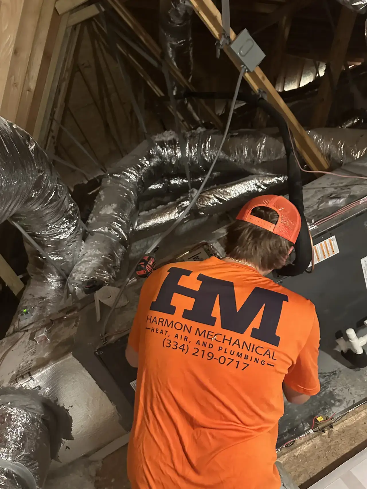 Harmon Mechanical HVAC contractor working on ducts and HVAC unit