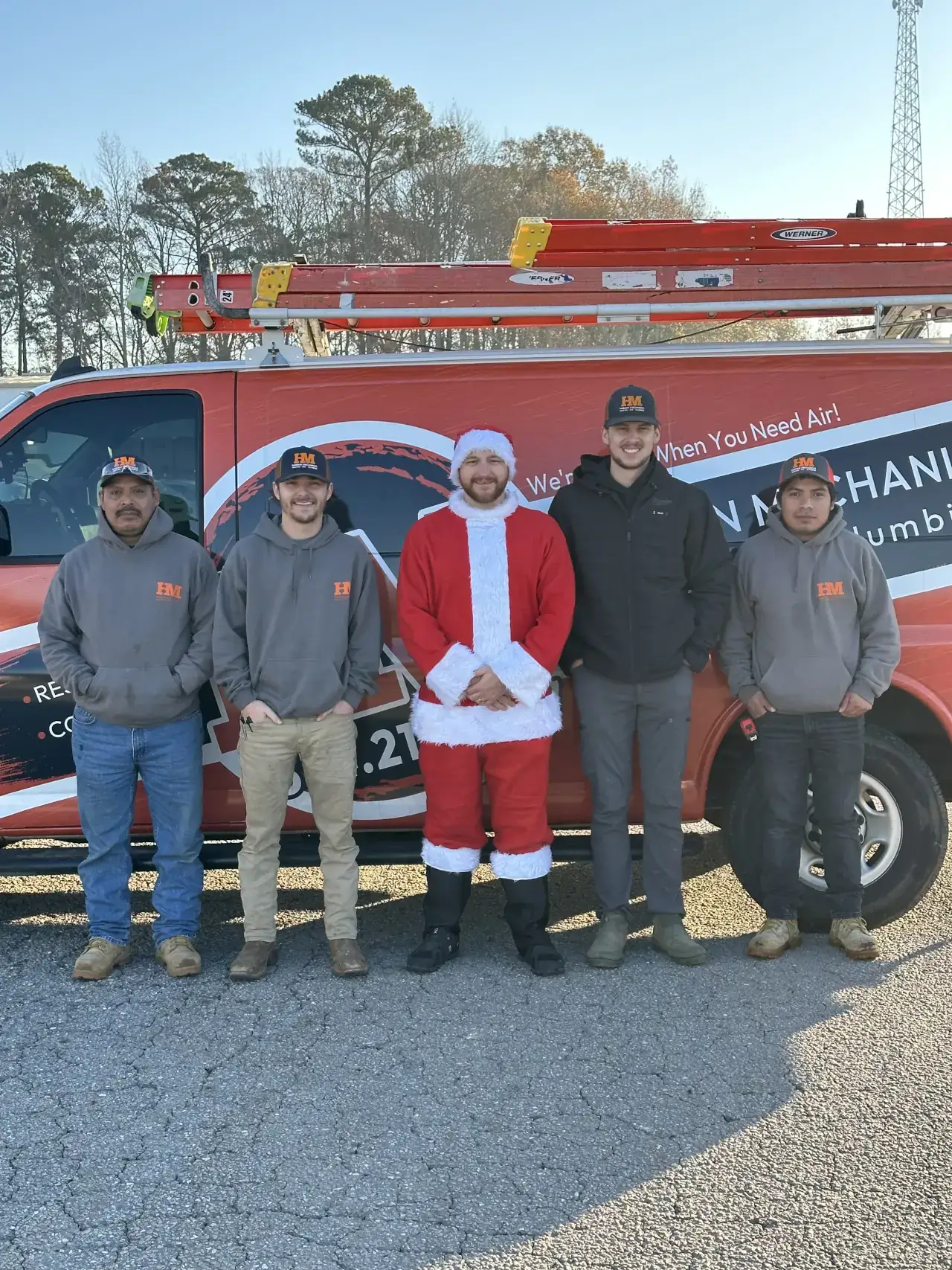 Harmon Mechanical team with a company van on the back