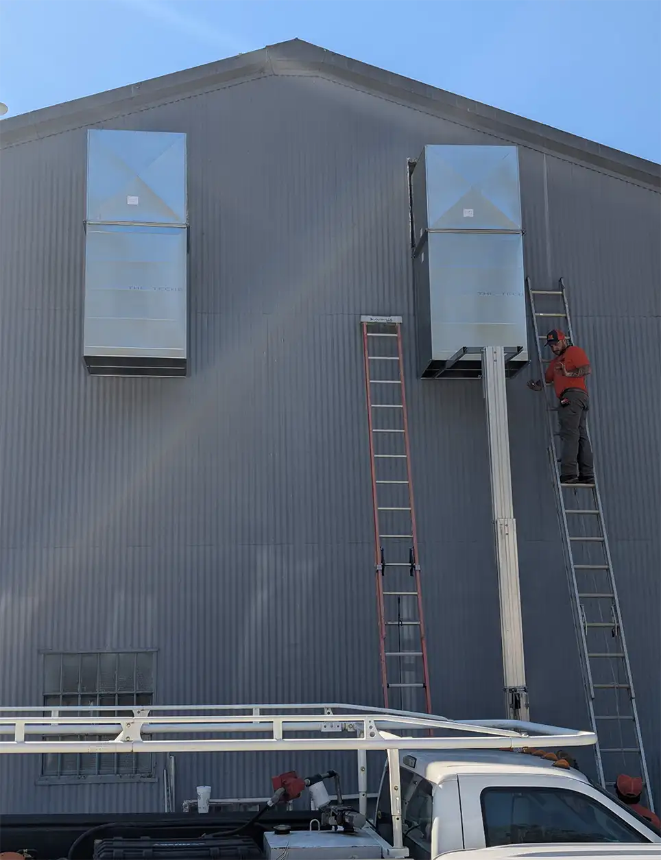Harmon Mechanical team performing duct work