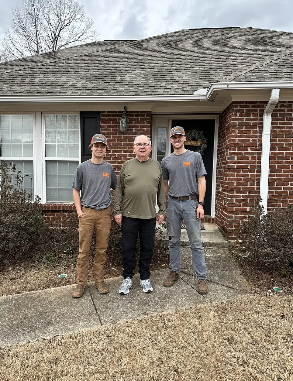 Two Harmon Mechanical team members with a client