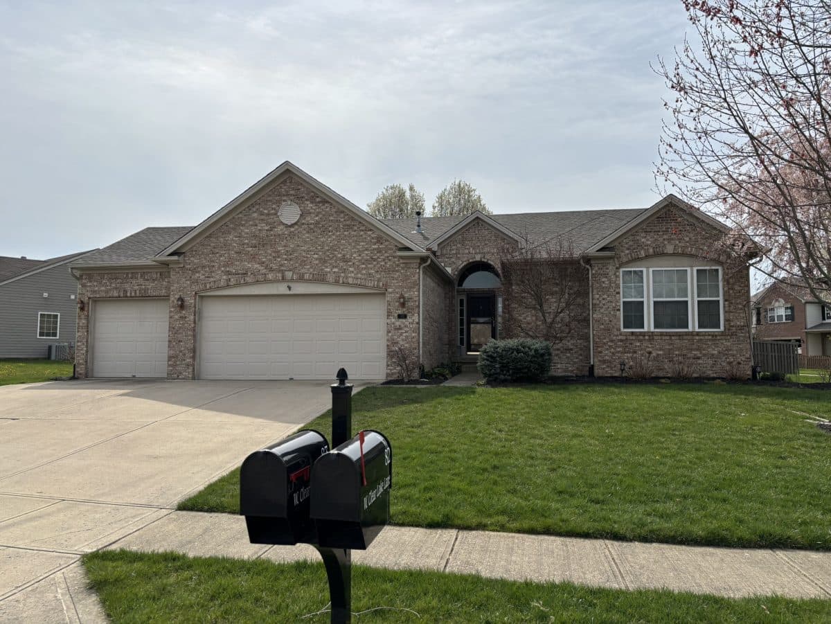 roofing warranty types big house with light grey shingles roof