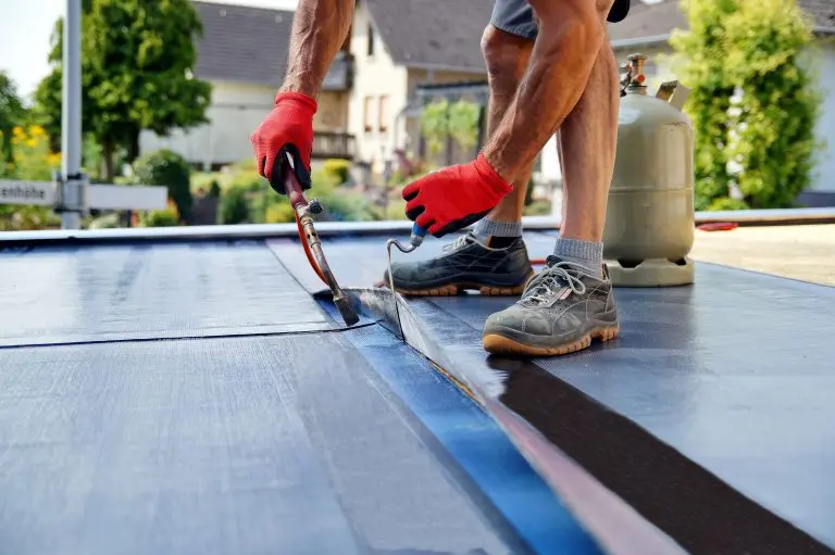 guy fixing flat roof