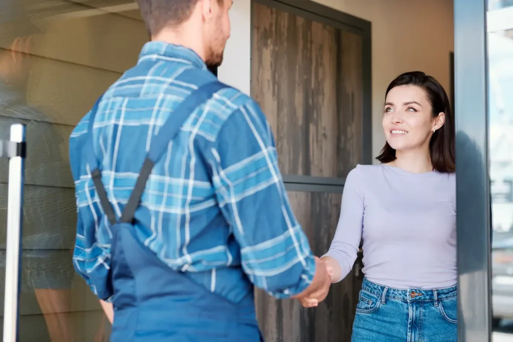 Woman greets HVAC worker