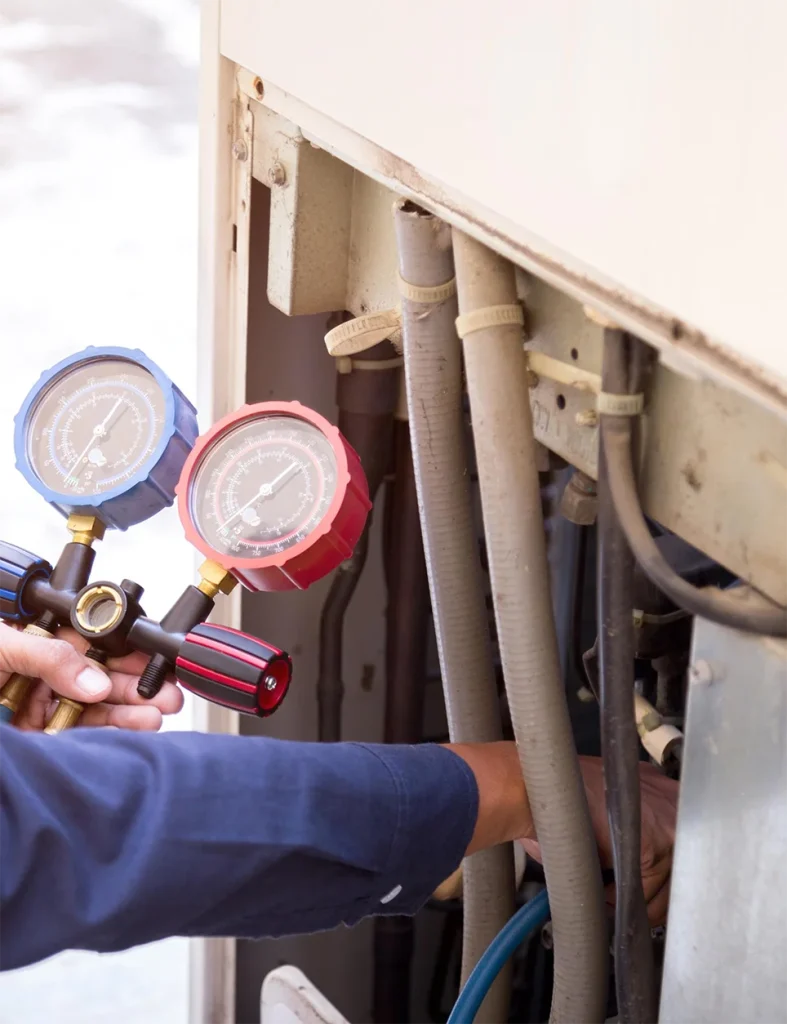 HVAC Worker inspecting gas levels