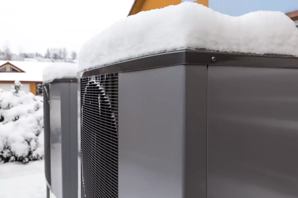 heat pumps covered in snow