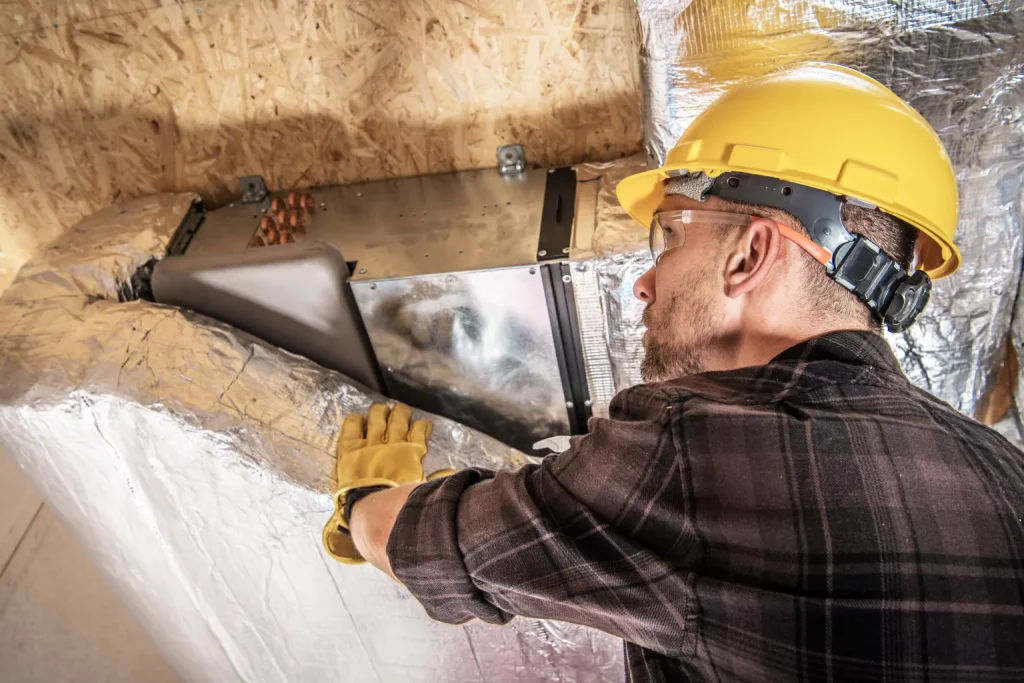 hvac professional inspecting ducts