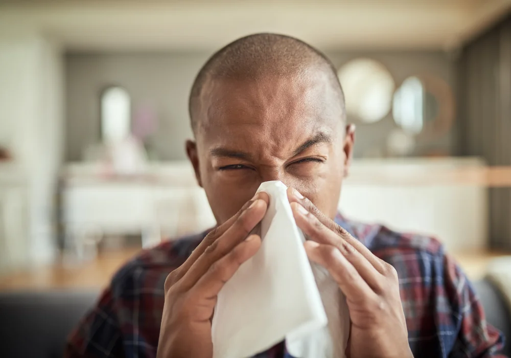 Man blowing his nose