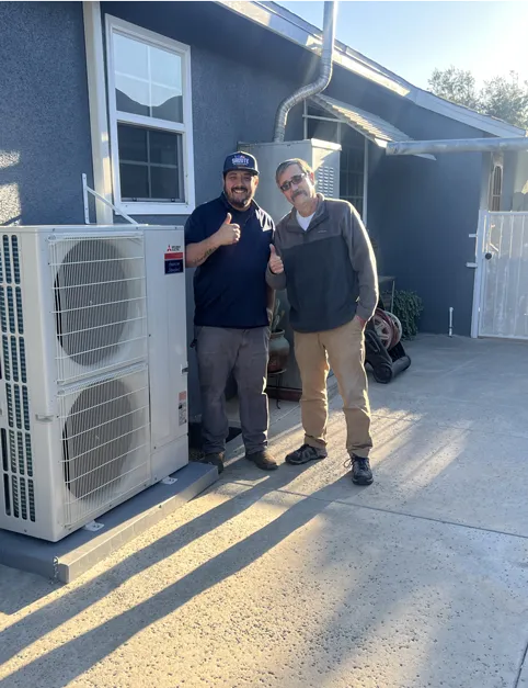 Salute technician next to a happy customer