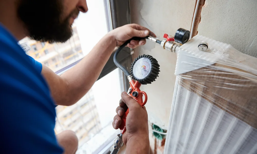 Worker repairing heater