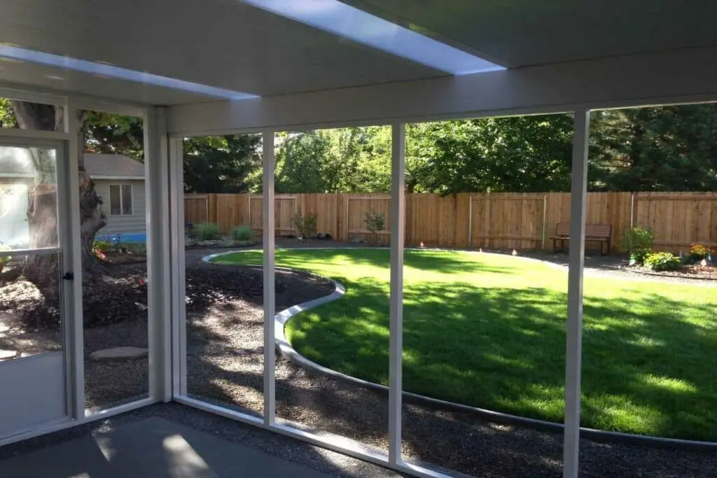 screens rooms installed near the garden Patio Covers Unlimited